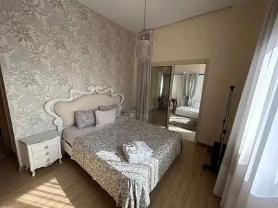 a bedroom with a bed and a mirror in a room at SeaView 6 Bedroom Villa & Private Pool in Limassol