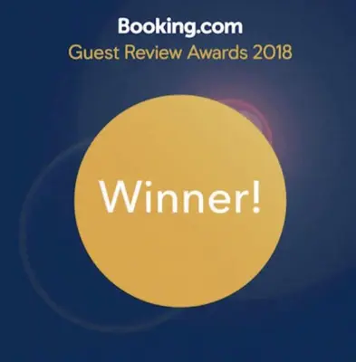 a sign with the words guest review awards on it at FIG TREE GIANNIS in Protaras