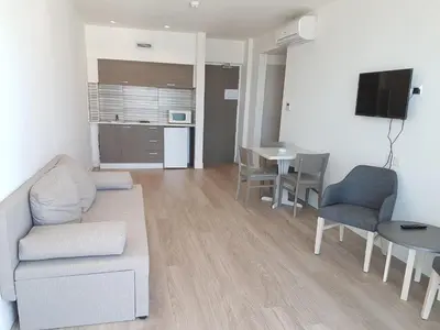 a living room with a couch and a table at Melini Hotel Suites in Protaras