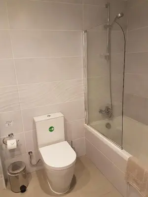 a bathroom with a toilet and a shower at Melini Hotel Suites in Protaras