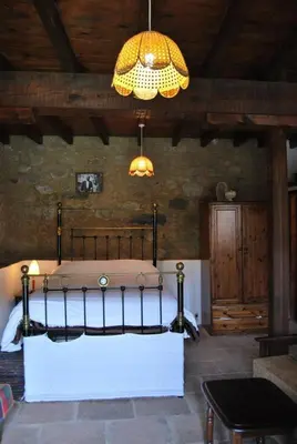 a bedroom with a bed and a chandelier at Xenis House in Galata