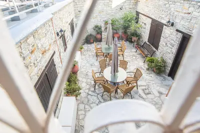 an overhead view of a patio with tables and chairs at Iosiphis Stonebuilt House in Pano Lefkara