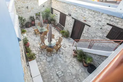 an overhead view of a patio with tables and chairs at Iosiphis Stonebuilt House in Pano Lefkara