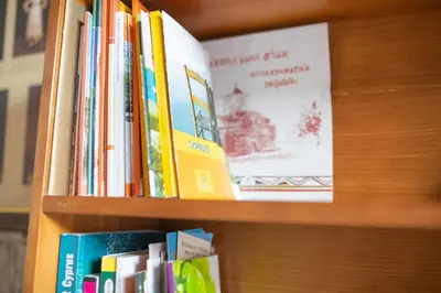 a book shelf with books on it at Iosiphis Stonebuilt House in Pano Lefkara