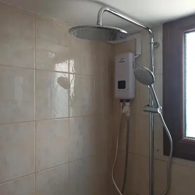 a shower with a shower head in a bathroom at Nicosia Luxury Studio in Nicosia