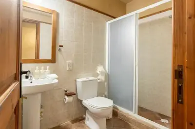 a bathroom with a toilet and a sink and a shower at Kardama HideAway in Kato Amiandos