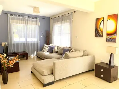 a living room with two couches and a couch at Villa Oceania in Ayia Napa