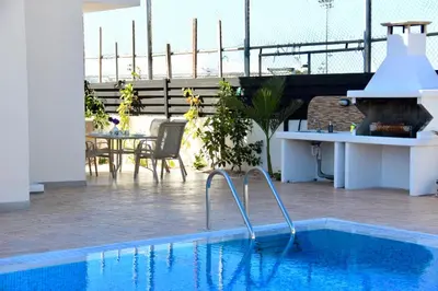 a swimming pool on the roof of a building at Villa Oceania in Ayia Napa