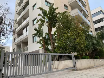a white fence in front of a building at Glabur Stays - The Nicosia Elite - Exceptional Top Floor Apartment Nicosia City, Welcomes U!!! in Nicosia