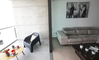 a living room with a couch and a chair at Glabur Stays - The Nicosia Elite - Exceptional Top Floor Apartment Nicosia City, Welcomes U!!! in Nicosia