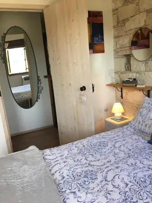 a bedroom with a bed and a mirror at Haven in Limassol