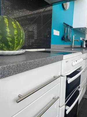 a kitchen with a melon on the counter at VILLA CATALEYA Fig Tree Bay Protaras Town Center in Protaras