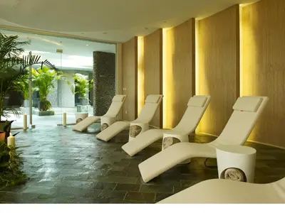 a row of white chairs in a lobby at Sunrise Pearl Hotel & Spa in Protaras