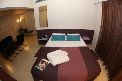 a hotel room with a bed with towels on it at Altius Boutique Hotel in Nicosia