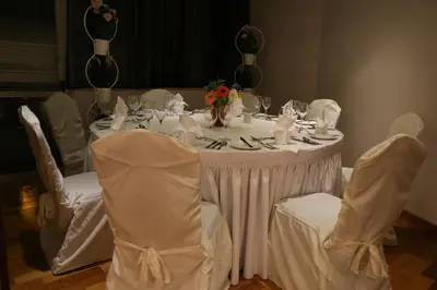 a white table with chairs and a white table cloth at Altius Boutique Hotel in Nicosia
