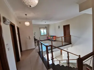 a view of a room with a staircase in a house at Orchard Blossom Private Villa With Pool in Phrenaros