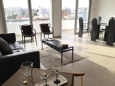 a living room with a couch and chairs and a table at RESIDENCE ONE in Limassol