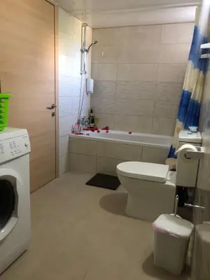 a bathroom with a toilet and a bath tub at Lucky 2 in Paralimni