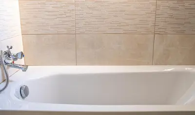 a white bath tub in a bathroom with a shower at Lucky 2 in Paralimni