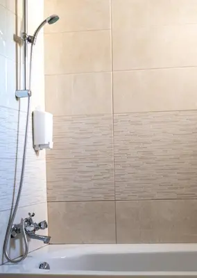 a shower in a bathroom with a bath tub at Lucky 2 in Paralimni