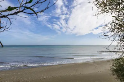 a view of the ocean from a beach at Faros BeachFront Villa in Pervolia