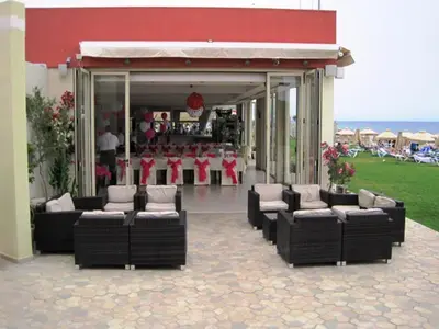 a group of chairs sitting outside of a store at Polyxenia Isaak Luxury Villas and Apartments in Protaras