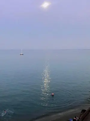 a large body of water with two boats in it at Governors Beach Costas Apts in Governors Beach