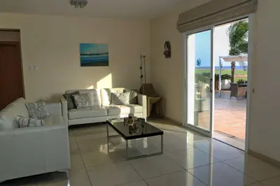 a living room with a couch and a coffee table at Villa Anastasia in Ayia Napa