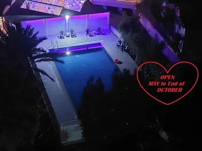 an overhead view of a swimming pool at night at Front-Row - Skyline Retreat - Pool Access in Larnaka