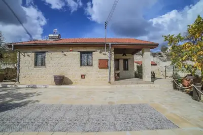 a house with a large driveway in front of it at Lofou Traditional House in Lofou