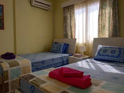 a bedroom with two beds and a window at Spacious 1 Bedroom Apartment in Kapparis Area in Paralimni