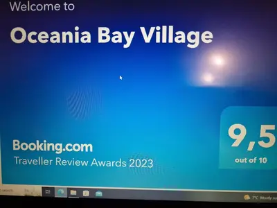 a computer screen with a sign that says ovarian bay village at Oceania Bay Village in Pyla