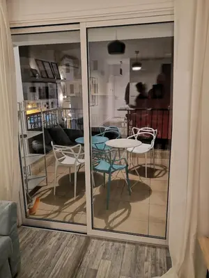 a view of a room with a table and chairs at Yippee!(Perfect Location) in Larnaka