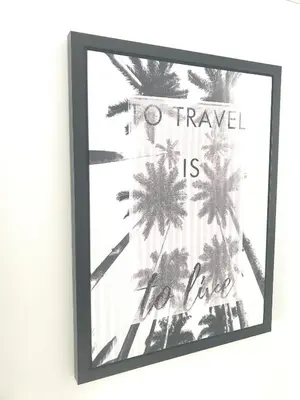 a picture of palm trees with a sign that reads to travel is to live at Margarita Napa Apartments in Ayia Napa