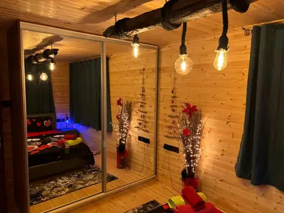 a room with a mirror and a bed in a room at SOFROS VALLEY HILLS CHALET in Ayios Mamas