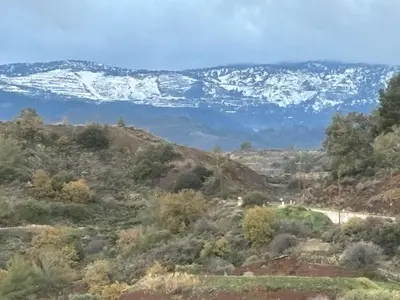 a view of snow covered mountains in the distance at SOFROS VALLEY HILLS CHALET in Ayios Mamas
