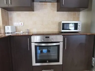 a kitchen with a microwave and a stove at BG04 Mythical Sands in Paralimni