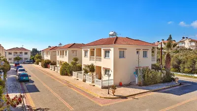 a row of houses on a residential street at Hadjios Valley in Mazotos