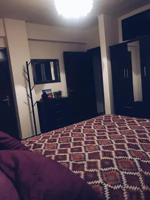 a bedroom with a bed and a dresser and a mirror at Studio in heart of Limassol in Limassol