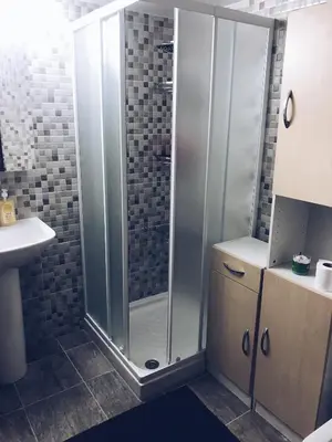 a bathroom with a shower and a sink at Studio in heart of Limassol in Limassol