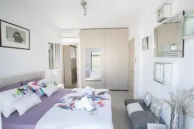 a bedroom with a bed and a couch at Villa Anemoni 8 in Protaras