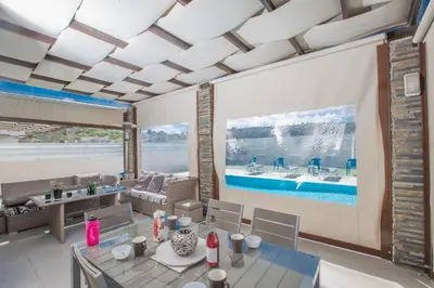 a living room with a large painting on the wall at Villa Anemoni 8 in Protaras