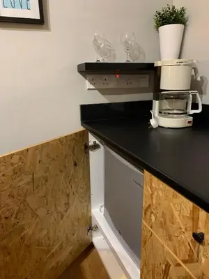 a kitchen with a counter top with a coffee maker at Strovolos Value Suites in Strovolos