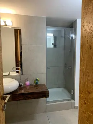 a bathroom with a shower and a sink at Strovolos Value Suites in Strovolos