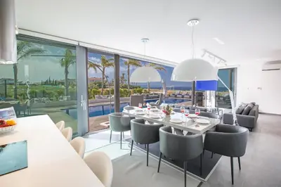 a dining room with a table and chairs at Villa Chana in Protaras