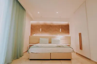 a bedroom with a large bed in a room at Hai Hotel in Larnaka