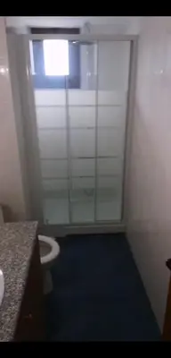 a bathroom with a toilet and a window in it at Aprosmeno Jacuzzi House 1 in Agros