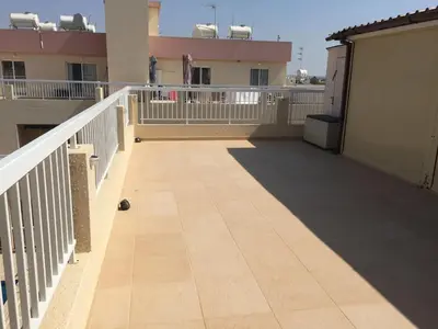 a balcony of a building with a white railing at 2 Bed Flat - Sleeps 4 - Pool - Parking - Wifi in Xylophaghou