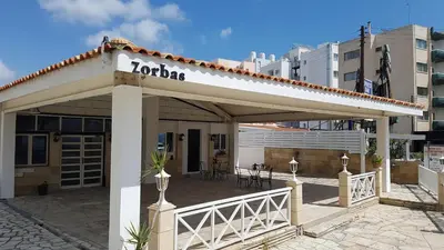 a building with a sign that reads loriaza at ZORBAS Sea View No 1 - Antoniella in Larnaka