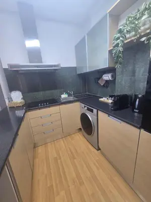 a kitchen with a sink and a dishwasher at Lazuli Sea View Beachfront- Ap 61 in Larnaka